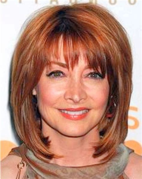 Shoulder length hairstyles for women over 60 - Here is my list of hairstyles with bangs for older women: Classic Bob Hairstyle with Bangs – A classic that never gets old. Side Swept Bangs – Sexy and playful. Natural Wispy Bangs – Great for thin hair. Natural Curled Bangs – A little curly action. Vintage Inspired Bangs – A trip back memory lane.